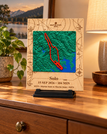 Custom 3D solo flight keepsake displayed on a dresser with warm room lighting.