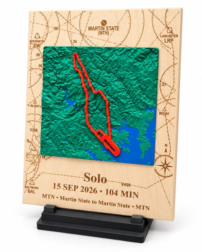 Front view of Martin State solo flight keepsake with engraved flight details and raised terrain map.
