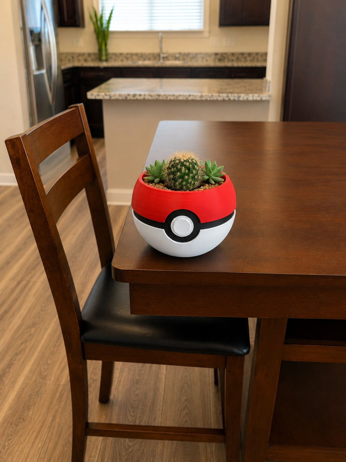 Pokeball inspired 3D printed planter with cactus and succulents