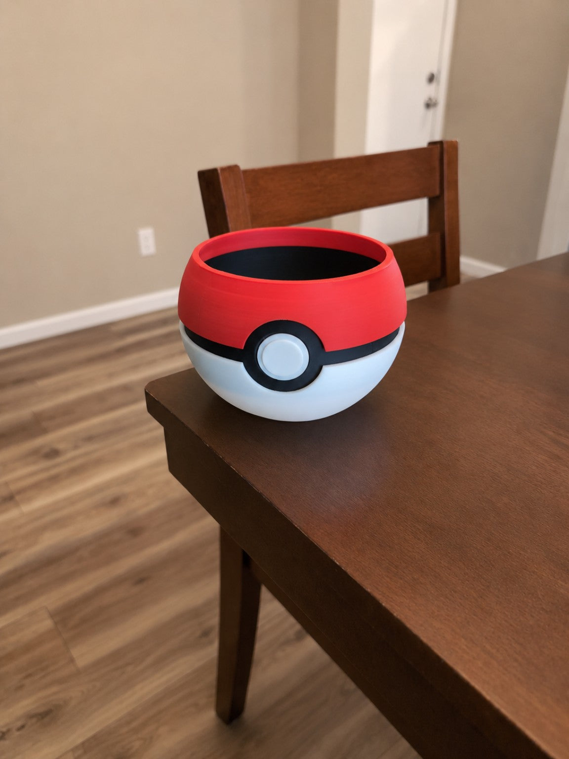 Pokeball inspired 3D printed planter empty on table