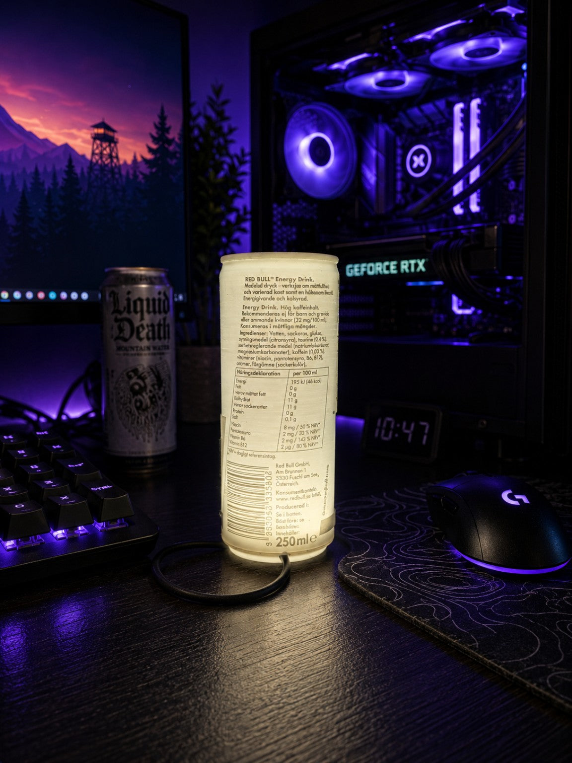 Back view of can-style lithophane desk lamp glowing on a gaming desk