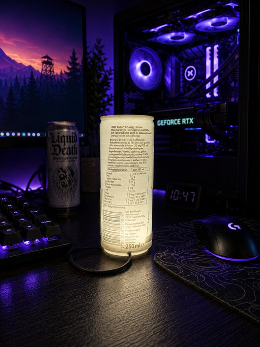 Back view of can-style lithophane desk lamp glowing on a gaming desk