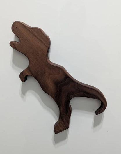 Magnetic wooden Dino oven puller in use