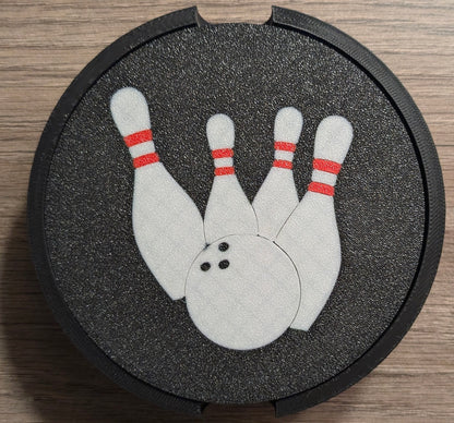 Close-up of bowling-themed 3D printed coasters